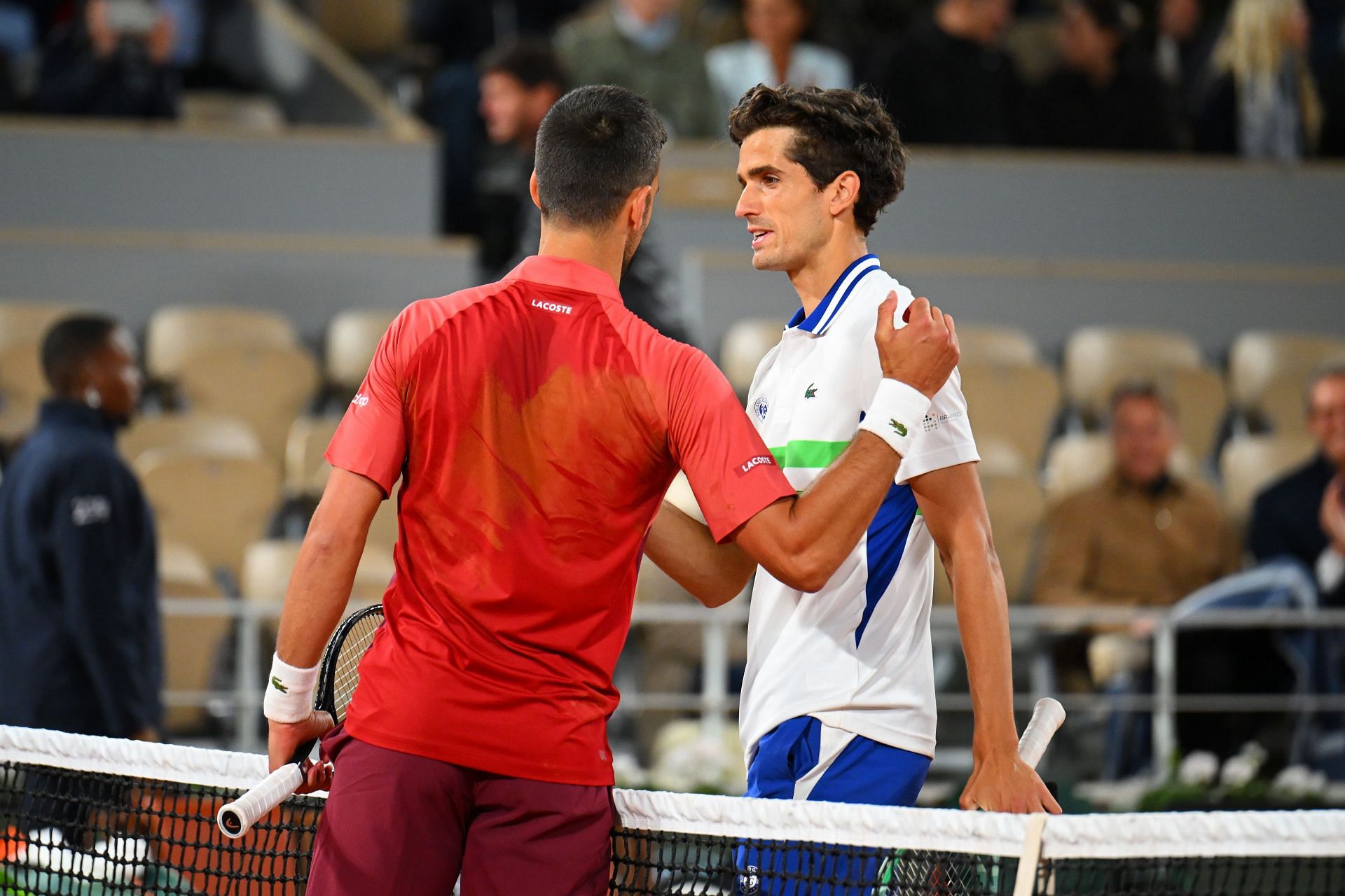 Novak Djokovic greets Pierre-Hugues Herbert at the 2024 French Open. GETTY